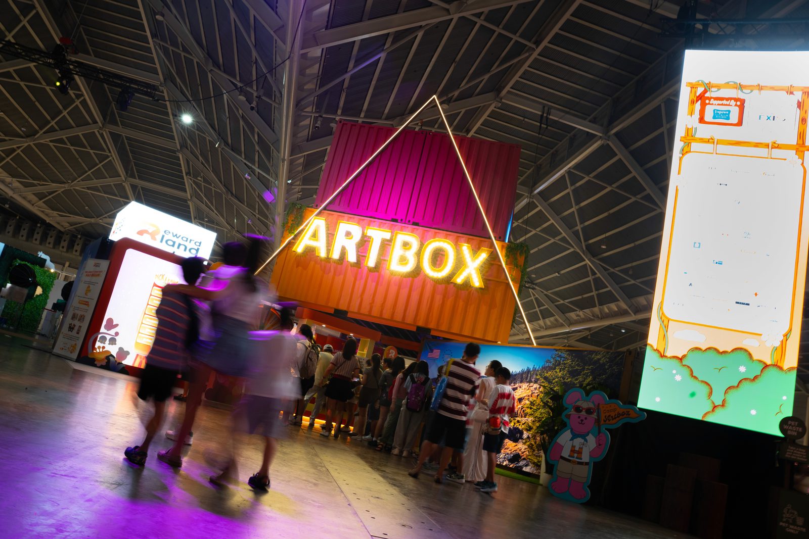 A booth of products with shoppers browsing at Artbox Singapore