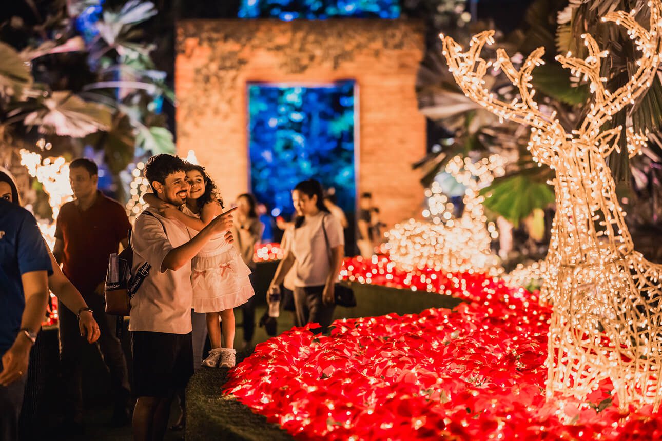 Visitors walking through Mistletoe Alley at Christmas Wonderland