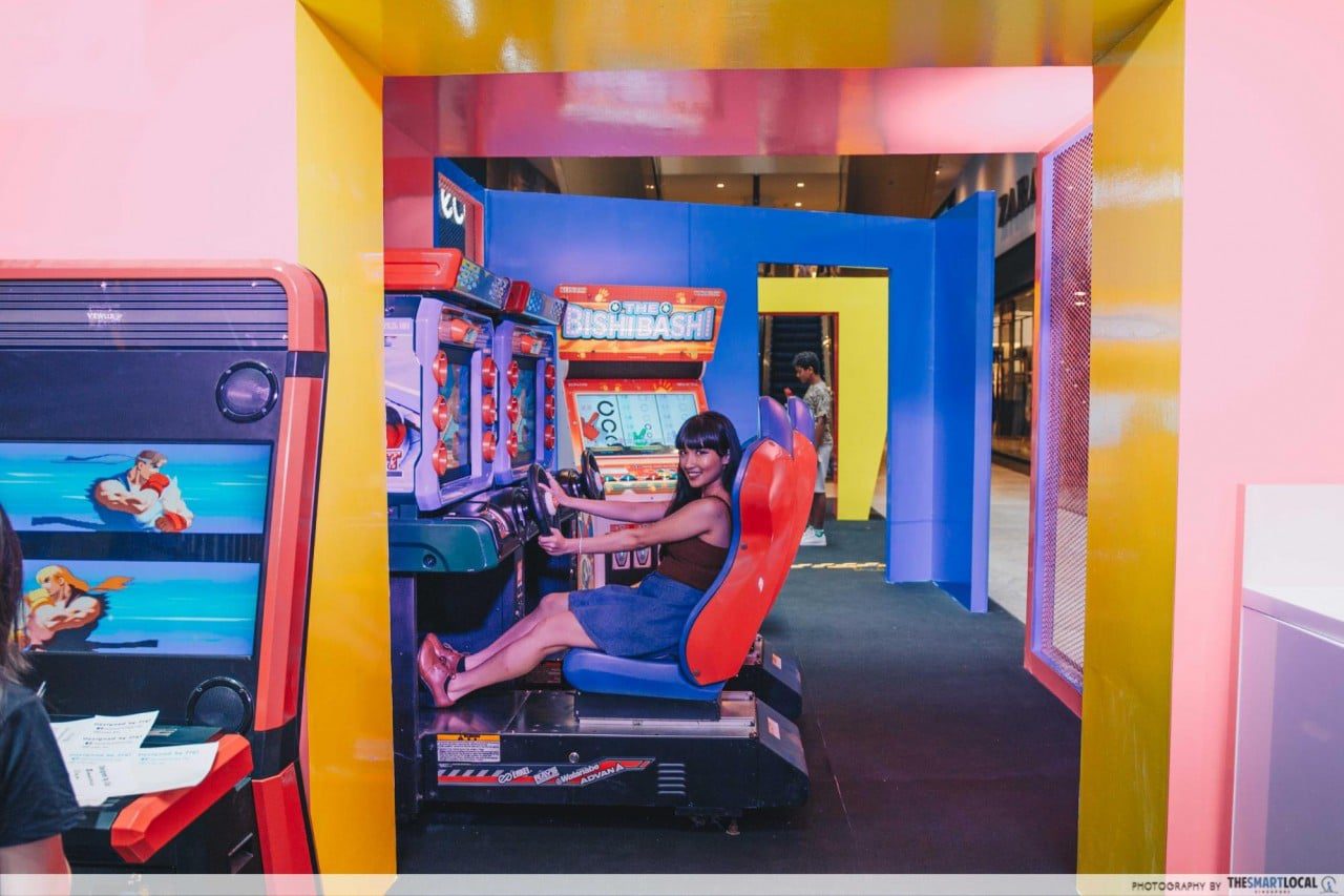 Pop-up arcade booths and game machines set up in the atrium of 313@somerset mall, Singapore