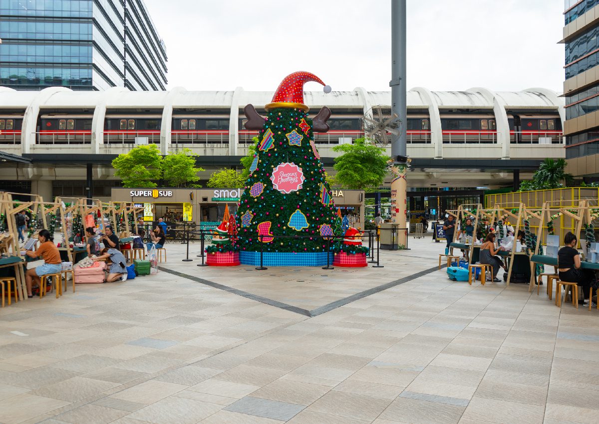 Wooden pop-up market stalls at the Joyful Christmas Village in the outdoor plaza of Paya Lebar Quarter (PLQ), a Lendlease mall in Singapore