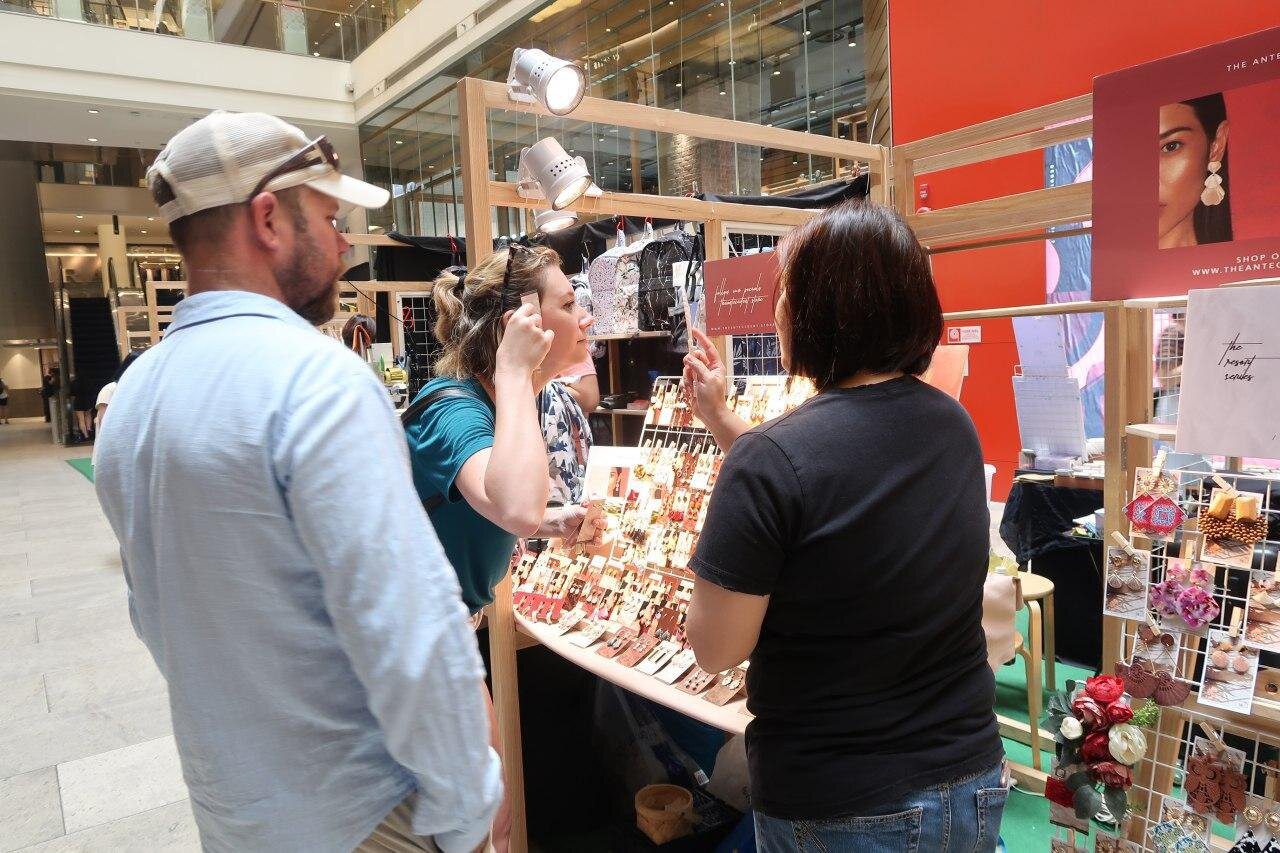 Artisan stalls displaying crafts and products at a Makers' Market by Invade, Singapore