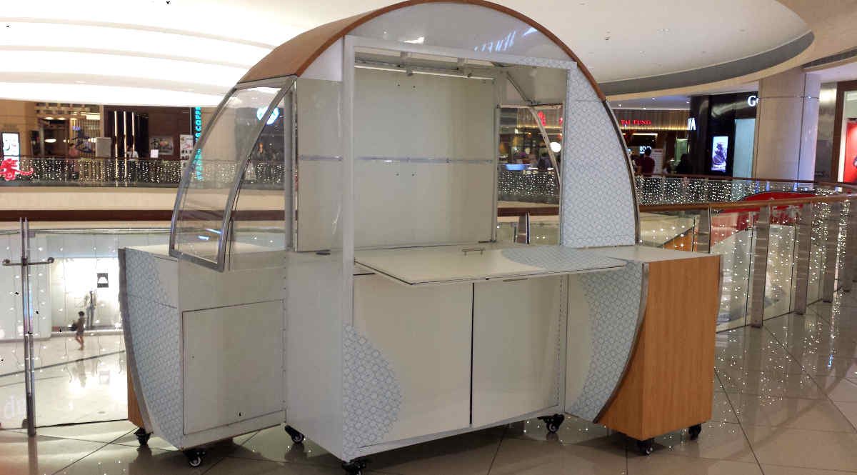 Generic retail push-cart kiosk on a Singapore shopping mall concourse