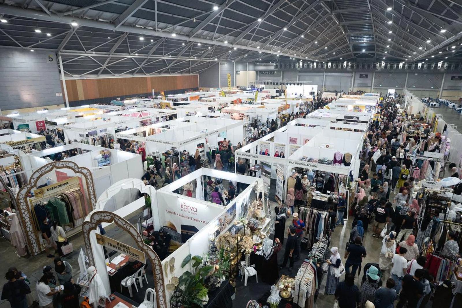 High-angle view of crowded aisles of modest-fashion, travel and lifestyle booths at SalamFest in a Singapore EXPO hall