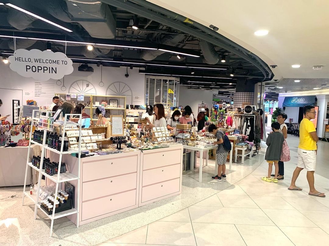 The POPPIN consignment shopfront by T Cartel in a Singapore mall, shelves of jewellery and beauty products under a Hello Welcome to POPPIN sign