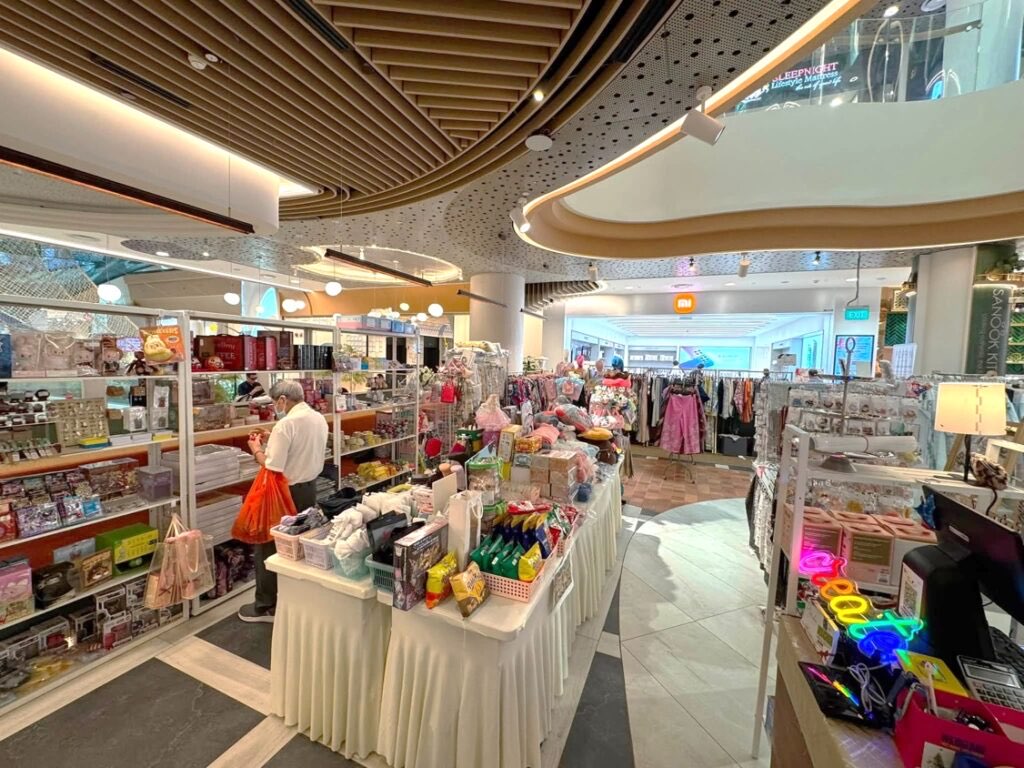 Vendor shelves and display tables inside the POPPIN unit at City Square Mall, Singapore