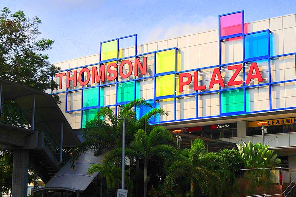 The exterior of Thomson Plaza shopping centre on Upper Thomson Road, Singapore, with its red sign and coloured glass panels, one of the malls this market rotates through